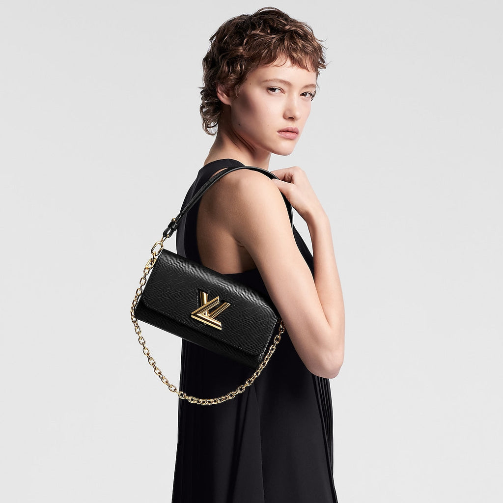Sac à main Louis Vuitton en cuir Epi noir avec logo LV doré et chaîne décorative