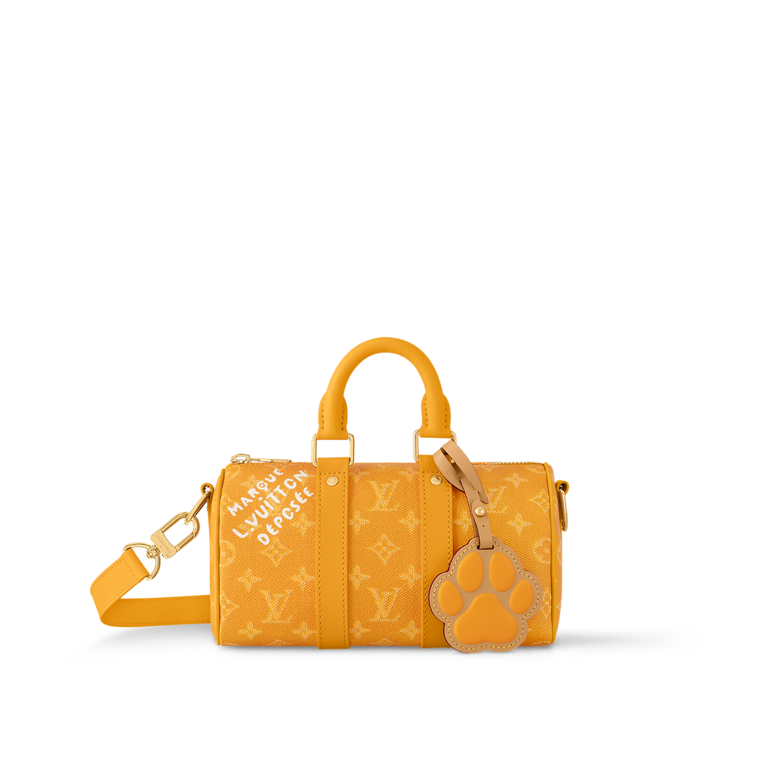 Sac Keepall Bandoulière 25 Louis Vuitton en toile Monogram jaune avec motif chien (collection LV x Animals / Paw)